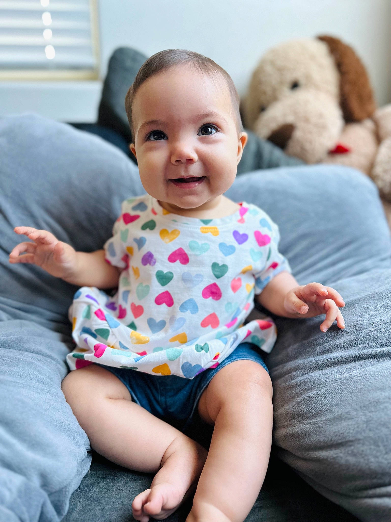 Juliette is registered to the contest to win money with this photo: baby, baby_toddler_clothing, cheek, child, comfort, eye, face, fun, happy, head, joy, pattern, person, pink, sitting, skin, sleeve, smile, t_shirt, toddler