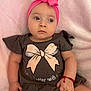 baby, child, pink_bow, headband, brown_shirt, pink_shorts, bracelet, soft_blanket, cute, infant, portrait, indoor, clothing, sitting, expression, adorable, person, baby_fashion, closeup, toddler