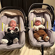 Juan Guerrero is registered to the contest to win money with this photo: awake, baby, bed, blanket, car_seat, child, clothing, cozy, cute, hat, indoors, infant, newborn, person, portrait, sitting, sleeping, soft_lighting, toddler, two_children