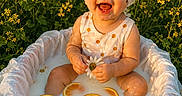 Alora Grace is registered to the contest to win money with this photo: baby, child, smiling, milk_bath, orange_slices, daisies, headscarf, polka_dot_dress, outdoor, flower_field, yellow_flowers, nature, summer, happy, portrait, sitting, cute, sunlight, playful, baby_photography