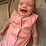 Millie-Mae is registered to the contest to win money with this photo: baby, infant, smiling, laughing, pink_outfit, bunny_print, cute, lying_down, blanket, soft_texture, happy, child, young, skin, face, arm, hand, buttoned_clothing, indoors, portrait