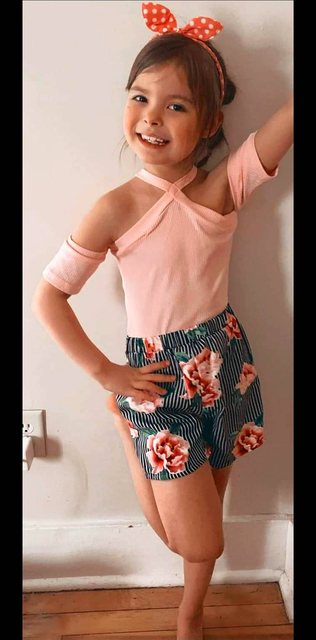 Layla is registered to the contest to win money with this photo: active_shorts, chest, elbow, gesture, head, human_body, joint, joy, knee, leg, neck, person, pink, shorts, skin, sleeve, sleeveless_shirt, smile, stomach, thigh