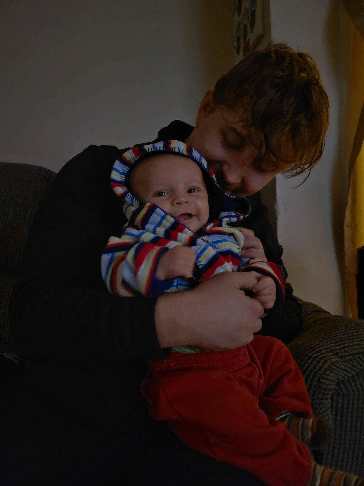 Ashton is registered to the contest to win money with this photo: abdomen, baby, baby_toddler_clothing, cheek, child, comfort, couch, event, fun, happy, iris, lap, mouth, nose, person, room, sitting, skin, smile, toddler