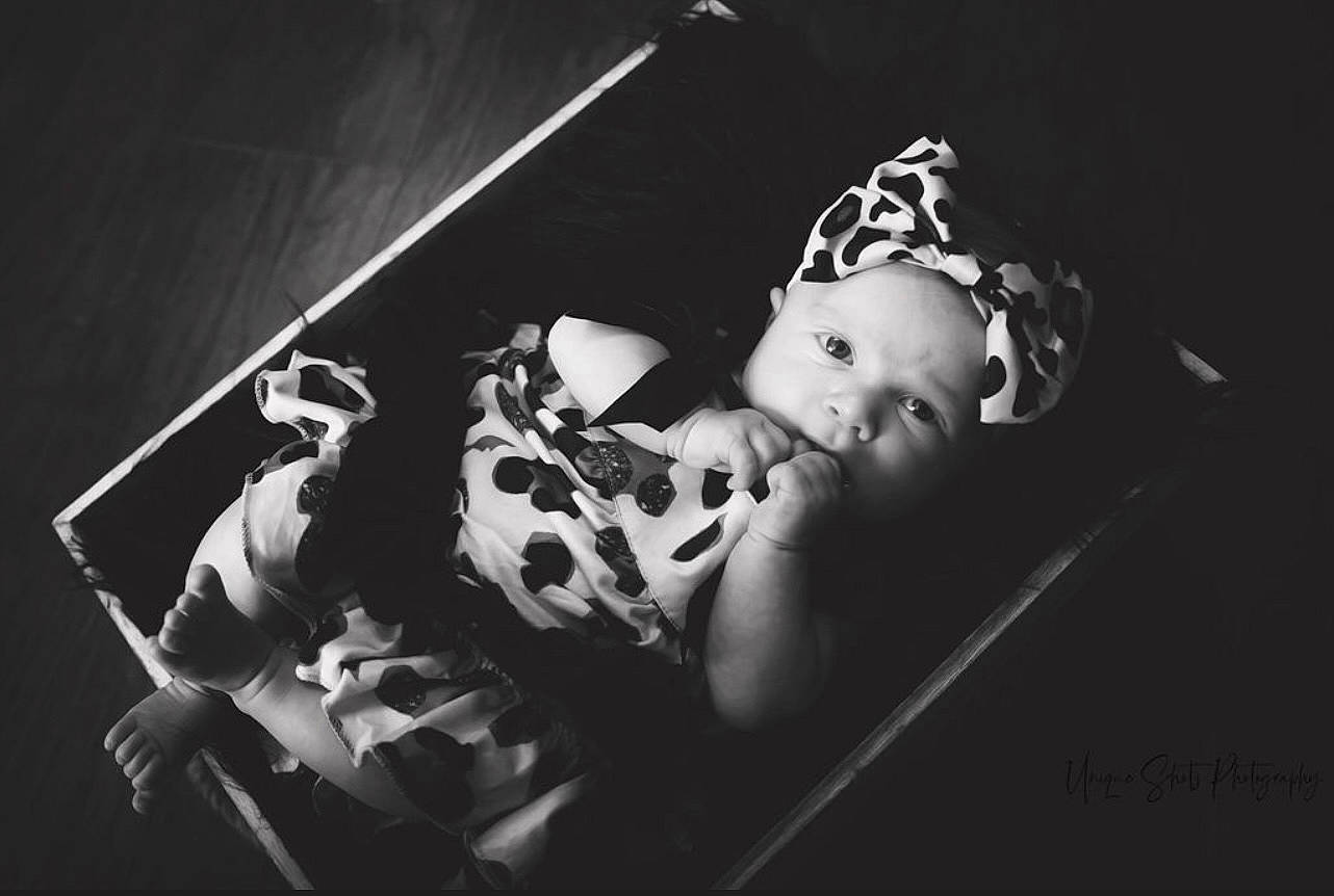 Addilynn joined the competition — help win amazing prizes! baby, baby_toddler_clothing, child, couch, darkness, entertainment, event, fashion_accessory, flash_photography, fun, headpiece, monochrome, monochrome_photography, person, personal_protective_equipment, portrait_photography, room, sitting, still_life_photography, toddler