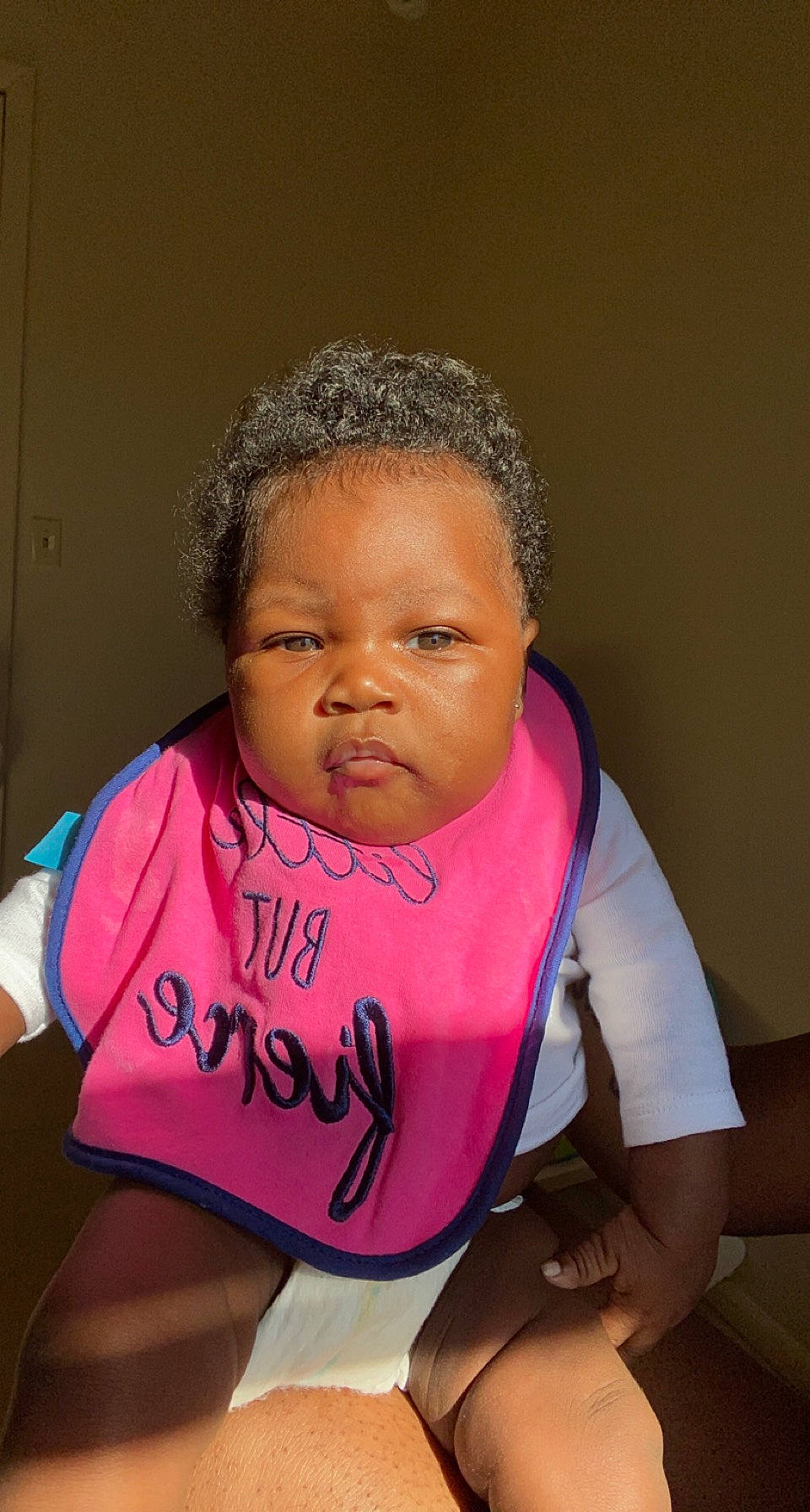 Chanel is registered to the contest to win money with this photo: active_tank, baby_toddler_clothing, bib, cheek, child, eyebrow, forehead, handwriting, neck, person
