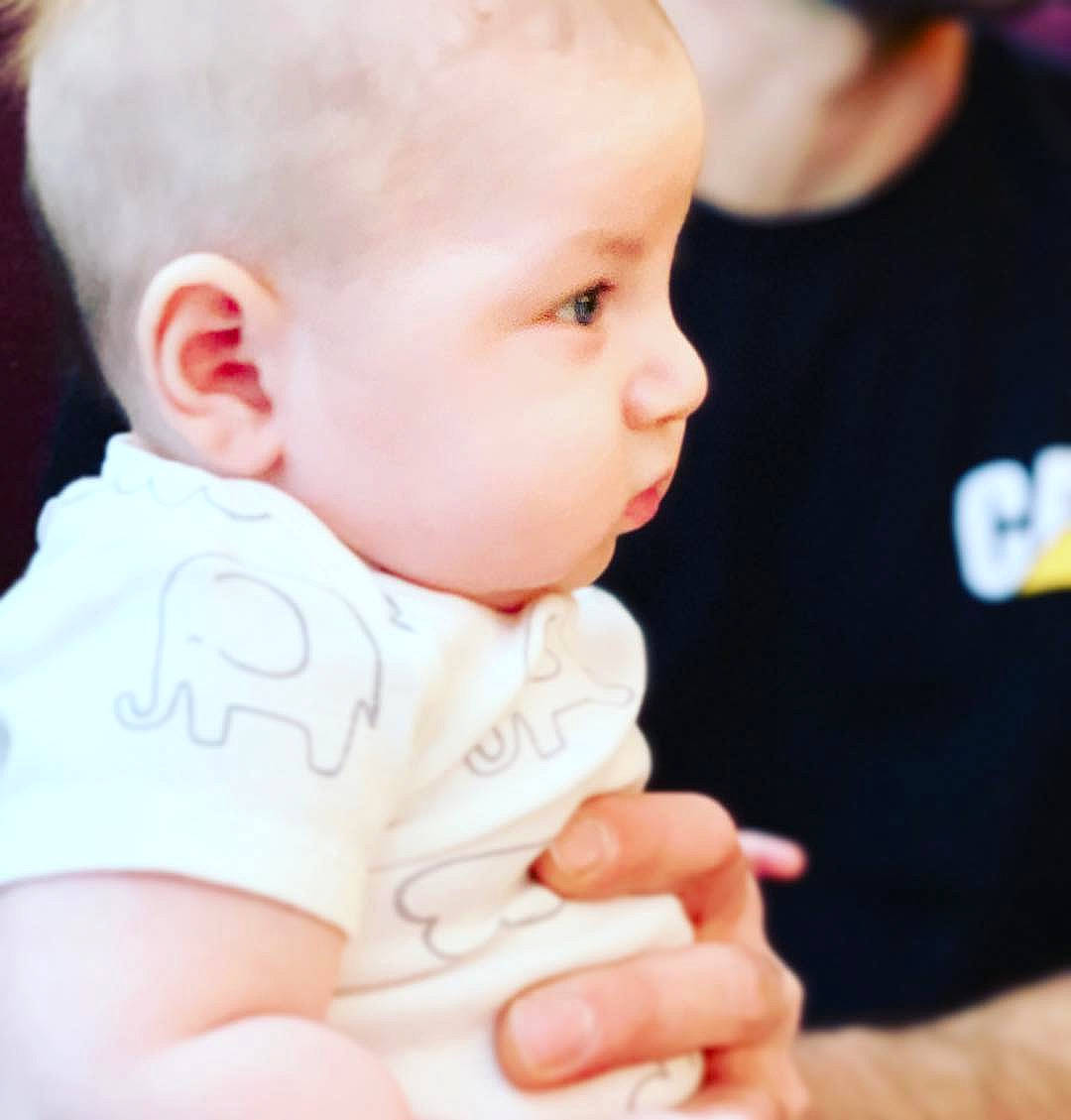 Logan is registered to the contest to win money with this photo: cheek, child, chin, ear, finger, hand, infant, neck, nose, person, product, skin, toddler