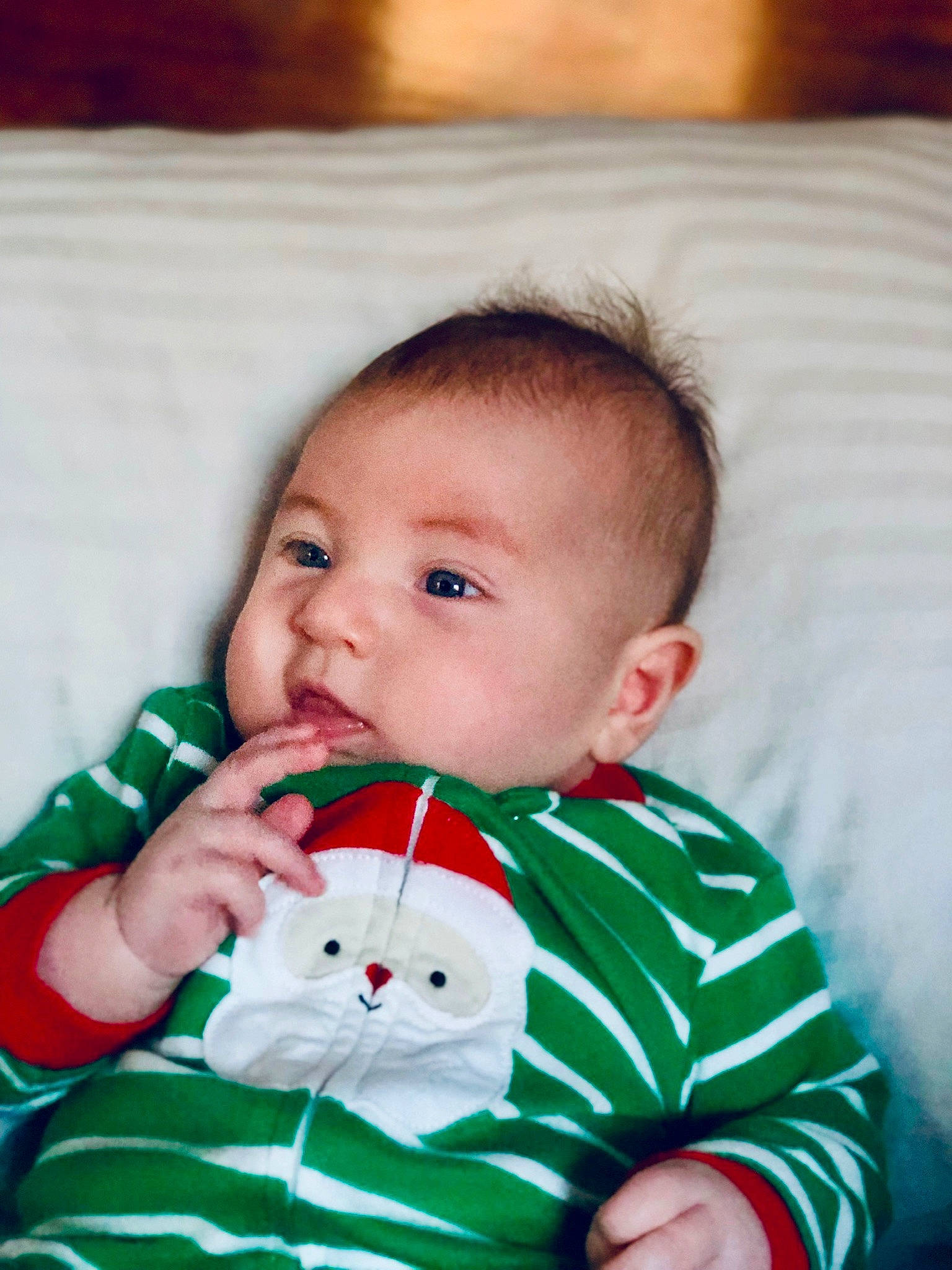 Logan is registered to the contest to win money with this photo: boy, cheek, child, christmas, eye, face, facial_expression, fun, green, head, infant, iris, laughter, nose, person, play, product, red, skin, smile