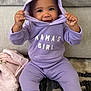 Shyloh is registered to the contest to win money with this photo: baby, child, hoodie, purple_clothing, smile, happy, sitting, indoors, blanket, couch, cute, person, face, playful, infant, toddler, cozy, portrait, carpet, home