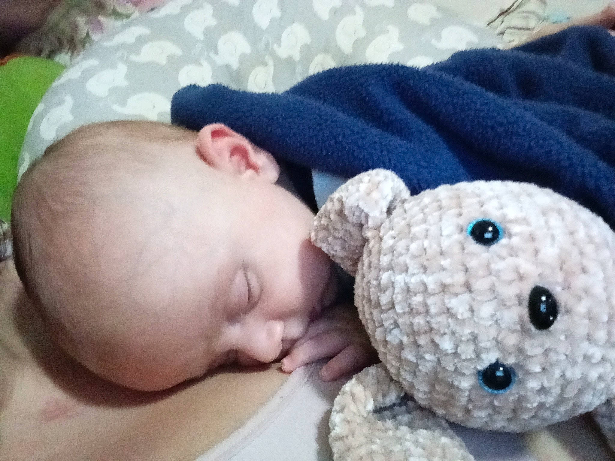 Carsen is registered to the contest to win money with this photo: art, baby, baby_sleeping, baby_toddler_clothing, cap, cheek, child, comfort, eye, knit_cap, pattern, person, product, skin, sleeve, stuffed_toy, textile, toddler, toy, white