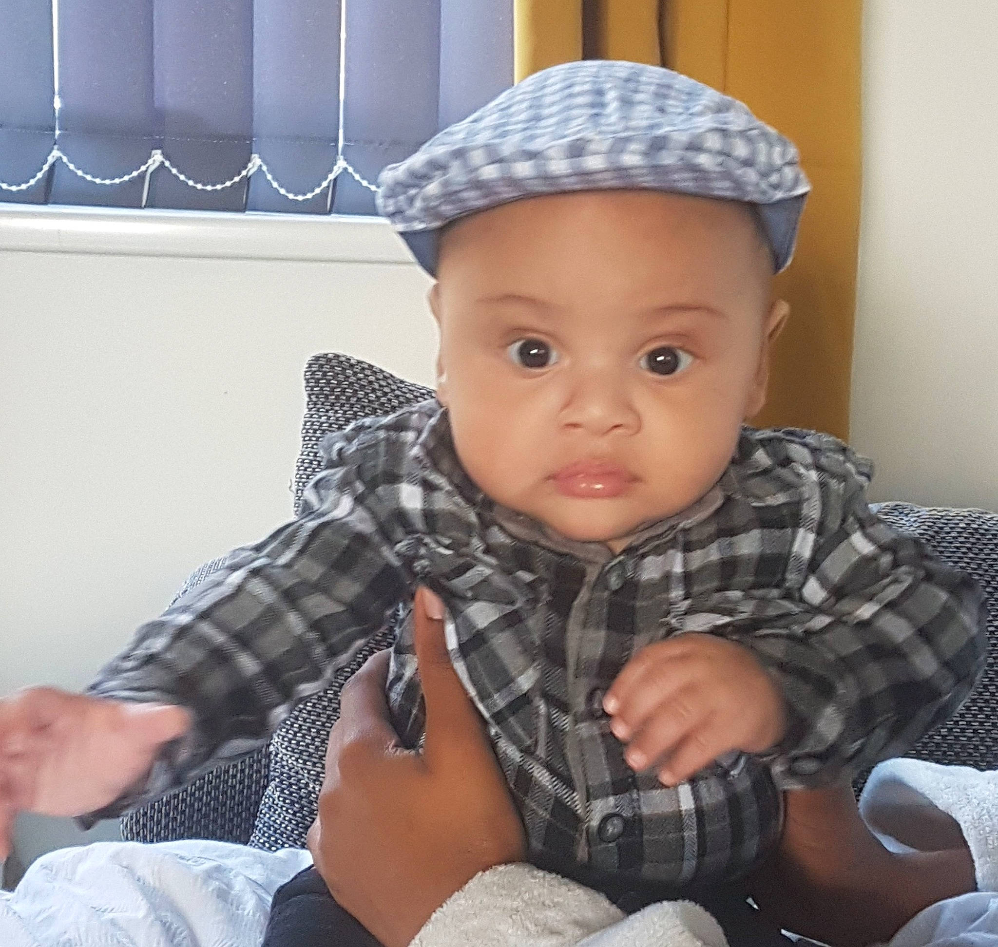 Alistair is registered to the contest to win money with this photo: baby, baby_toddler_clothing, bonnet, cap, child, cool, design, finger, hand, hat, head, headgear, pattern, person, photography, plaid, sitting, tartan, textile, toddler