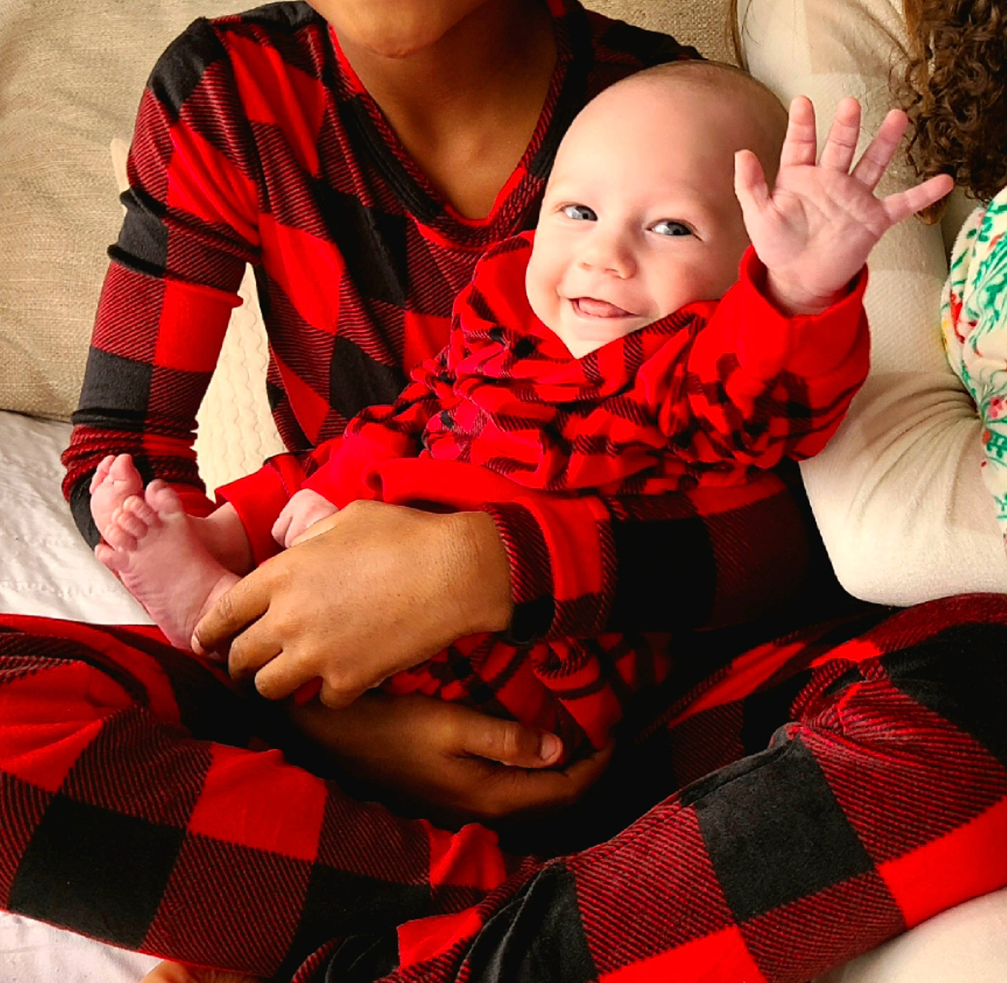 Castiel is registered to the contest to win money with this photo: baby, baby_toddler_clothing, comfort, face, gesture, happy, head, human_body, lap, pattern, person, plaid, red, sleeve, smile, sock, tartan, textile, thigh, toddler