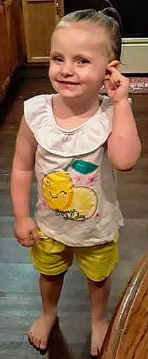 Skarlett is registered to the contest to win money with this photo: arm, baby, baby_toddler_clothing, chest, elbow, finger, gesture, happy, joy, neck, pattern, person, play, shorts, sleeve, smile, t_shirt, thigh, thumb, toddler