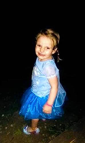 Skarlett is registered to the contest to win money with this photo: baby_toddler_clothing, blond, child, child_model, darkness, day_dress, electric_blue, flash_photography, fun, grass, happy, iris, joy, magenta, person, portrait, portrait_photography, sandal, sitting, smile