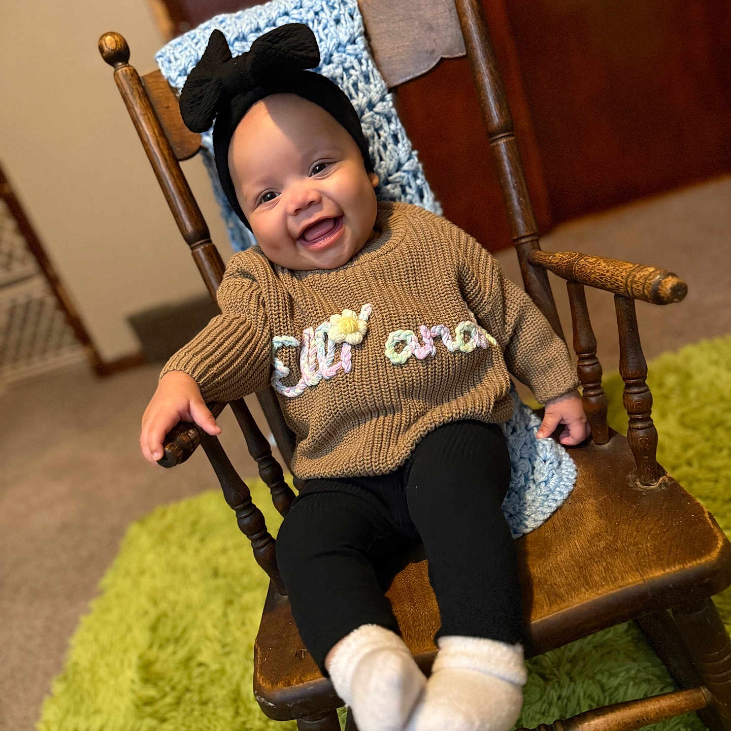 Ellianah joined the competition — help win amazing prizes! armchair, baby, babylaughing, chair, clothing, face, furniture, happy, hat, head, knitwear, laughing, pants, person, photography, portrait, rockingchair, sitting, smile, sweater