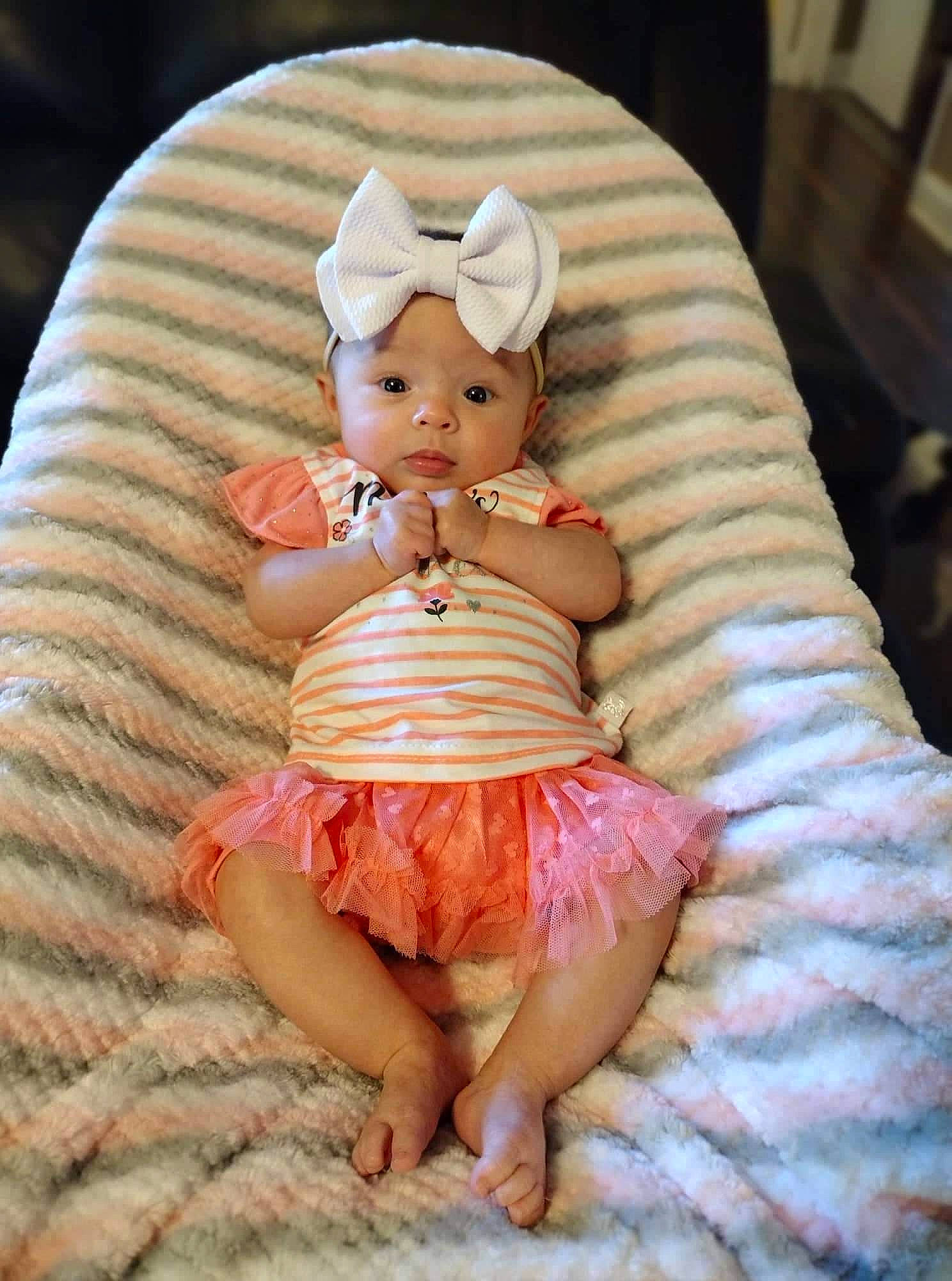 Jaylee joined the competition — help win amazing prizes! cheek, child, comfort, doll, dress, eye, fawn, finger, glasses, head, headgear, headwear, human_body, human_leg, lap, person, pink, skin, textile, thigh