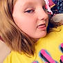 Skylar is registered to the contest to win money with this photo: child, face, yellow_shirt, tongue_out, flower_filter, light_brown_hair, casual, indoor, clothing, colorful, playful, portrait, person, young, fun, expression, filter, messy_background, closeup, smiling