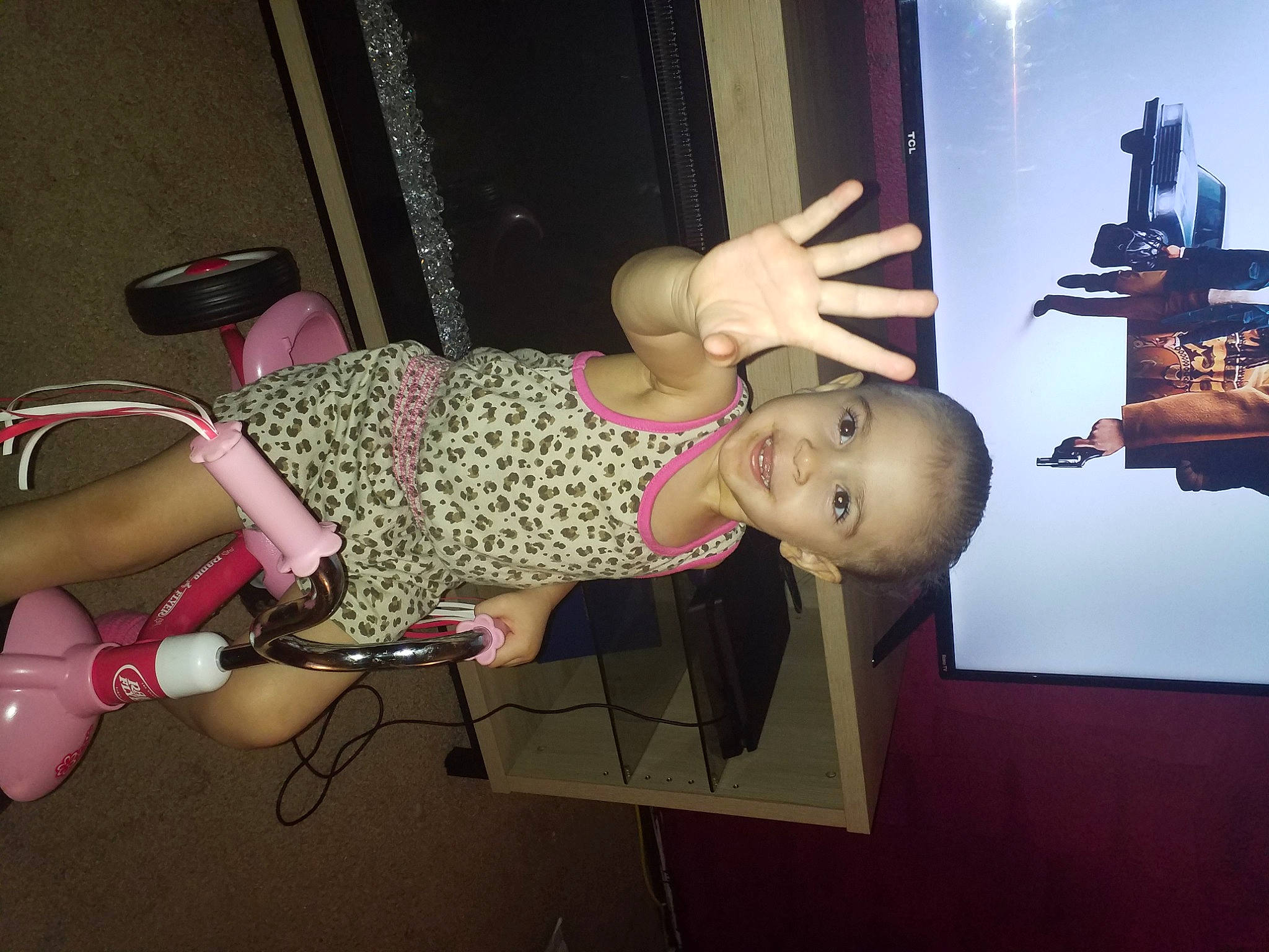 Raina joined the competition — help win amazing prizes! arm, art, baby, child, display_device, fun, human_leg, joy, knee, magenta, material_property, pattern, person, room, sandal, smile, thigh, toddler, visual_arts