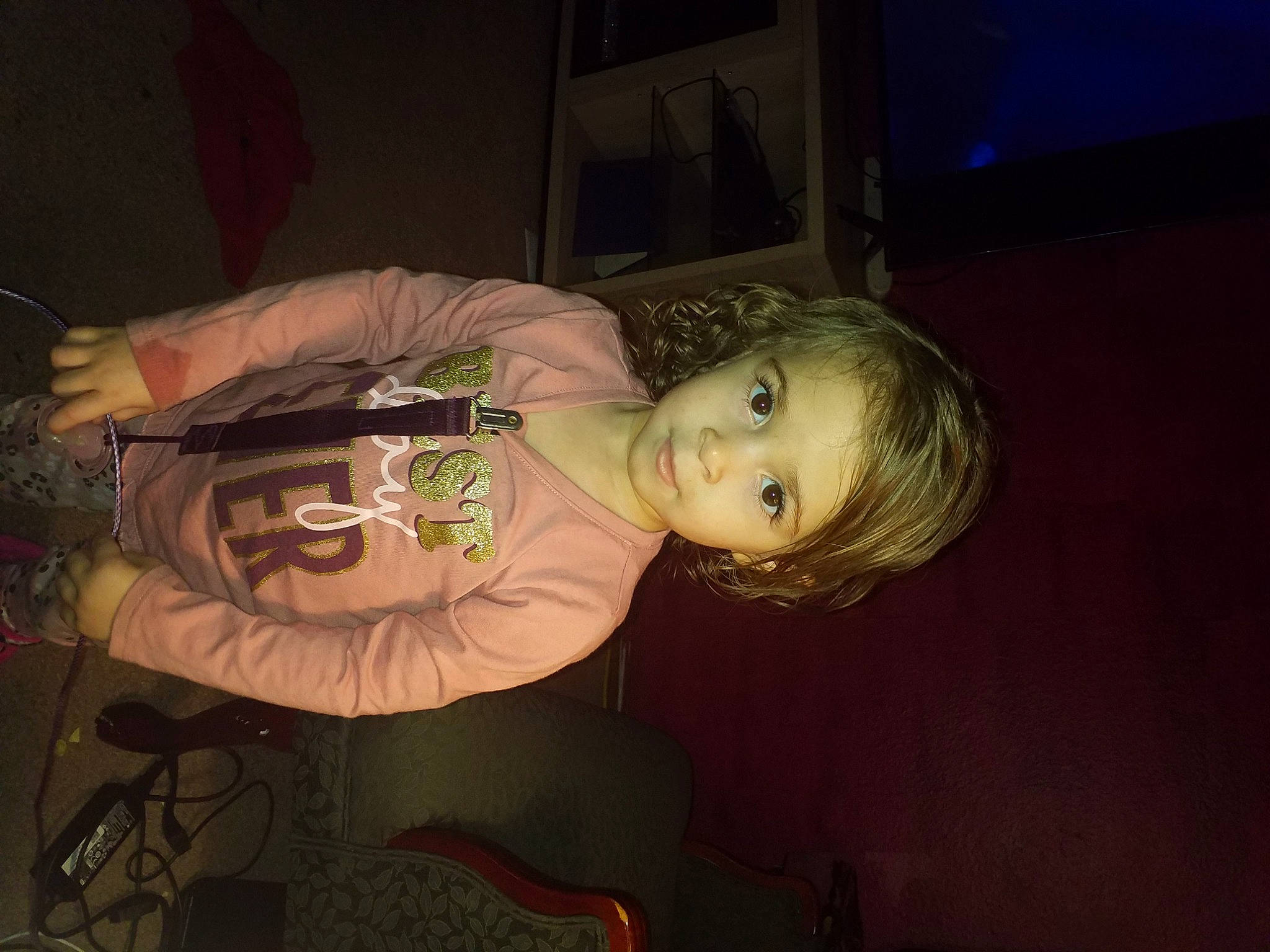 Raina joined the competition — help win amazing prizes! cheek, child, cloud, darkness, flash_photography, fun, iris, mouth, night, nose, person, picture_frame, room, shelf, sitting, smile, space, television, tints_and_shades, toddler