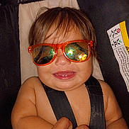 Ransom joined the competition — help win amazing prizes! automotive, baby, car_seat, child, close_up, eyes, face, fashion, hair, humorous, indoor, infant, orange_glasses, photograph, portrait, safety, seatbelt, seated, smiling, sunglasses