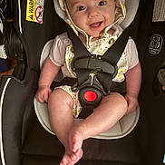 Kenedee is registered to the contest to win money with this photo: baby, child, car_seat, smile, happy, straps, safety, bonnet, infant, cute, clothing, seat, closeup, person, young_child, cheerful, indoors, comfort, secured, portrait
