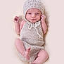 baby, beanie, bodypart, bonnet, cap, clothing, face, finger, hand, hat, head, newborn, person, photography, portrait