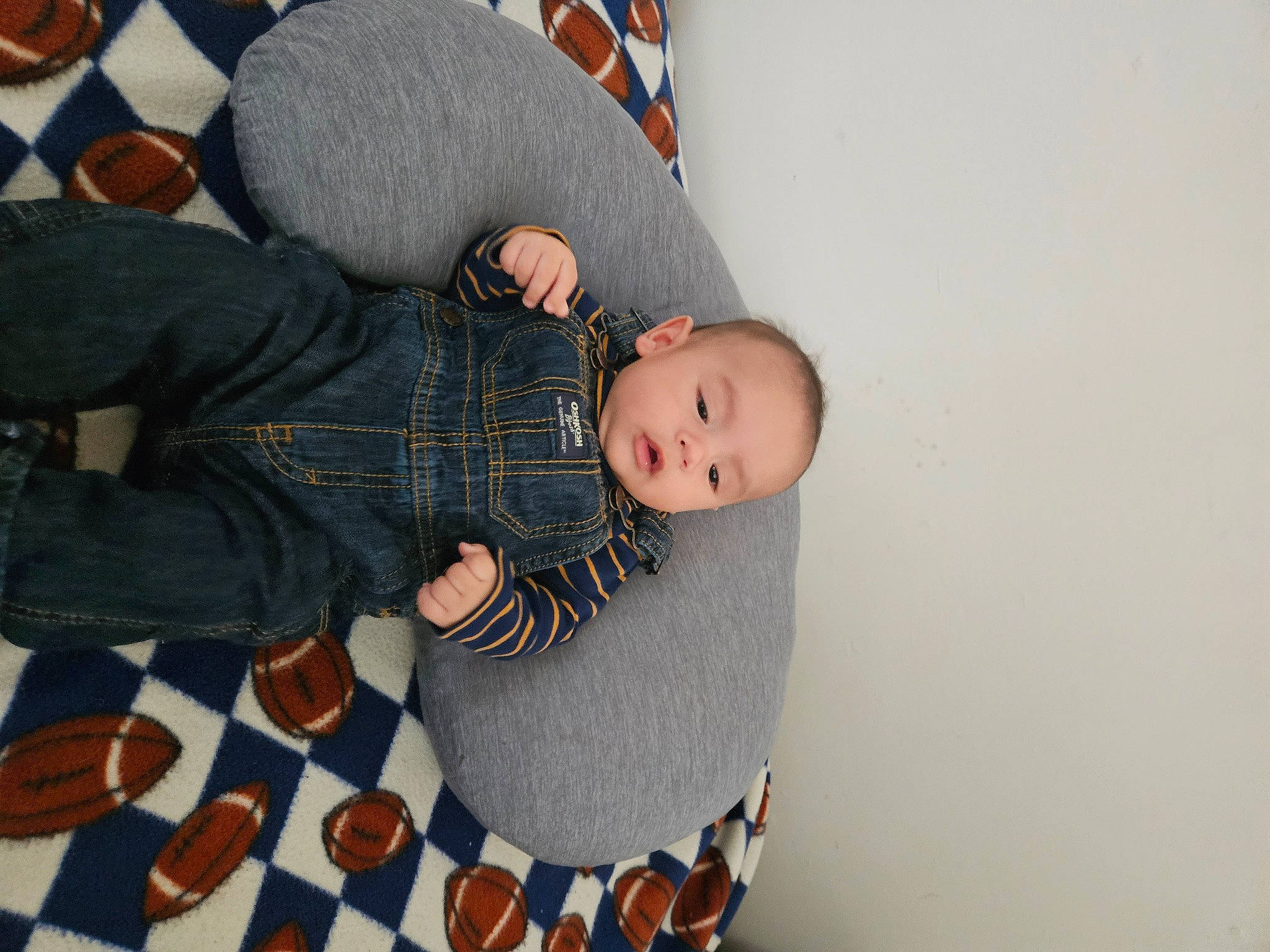 Brody is registered to the contest to win money with this photo: baby, baby_toddler_clothing, child, comfort, flooring, foot, fun, human_leg, knee, lap, pattern, person, sitting, sleeve, sock, textile, thigh, toddler, tree, trunk