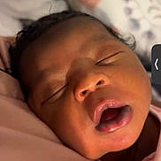 Marlaya is registered to the contest to win money with this photo: baby, sleeping, close_up, face, mouth_open, newborn, soft, pink, skin, infant, peaceful, resting, portrait, child, cute, indoors, head, expression, calm, human