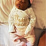 Marlaya is registered to the contest to win money with this photo: baby, sleeping, pink_bow, headband, white_shirt, pants, slippers, bed, blanket, infant, cute, peaceful, closeup, indoors, soft_lighting, child, portrait, resting, cozy, adorable