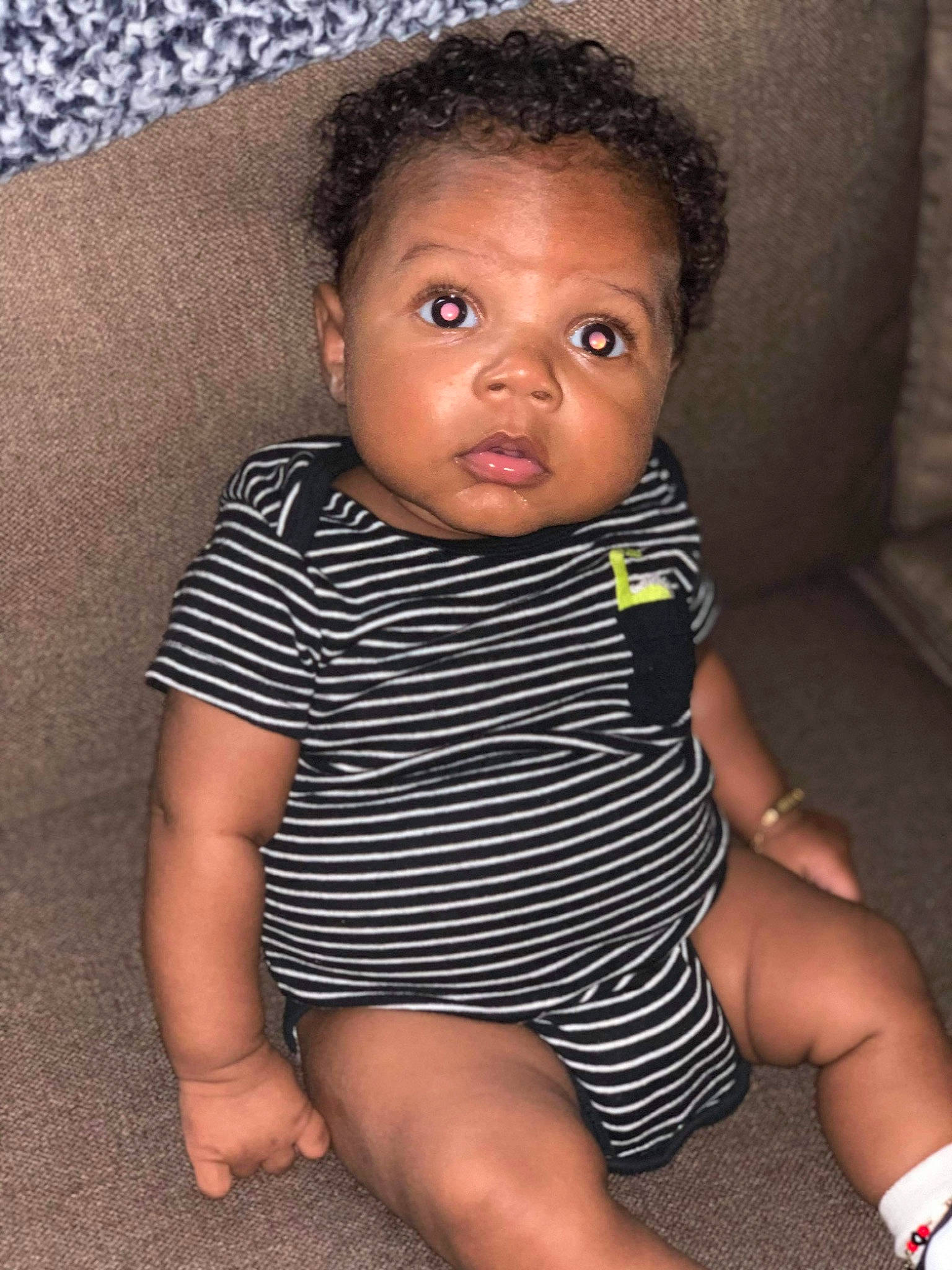 Javion joined the competition — help win amazing prizes! baby, black_hair, cheek, child, eye, face, fun, head, leg, lip, nose, person, sitting, skin, smile, thigh, toddler, vacation