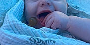 Kinsley is registered to the contest to win money with this photo: baby, babylaughing, blanket, bodypart, face, finger, furniture, hand, happy, head, laughing, mouth, newborn, person, photography, portrait, purple, quilt, smile, towel
