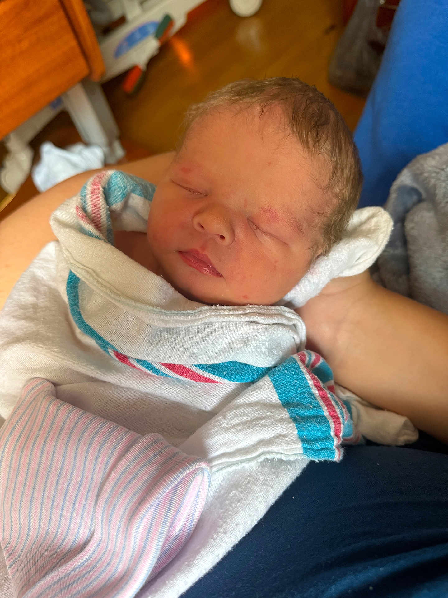 James joined the competition — help win amazing prizes! newborn, baby, sleeping, blanket, hospital, arm, person, face, skin, clothing, indoor, resting, infant, cute, peaceful, closeup, head, soft, wrapped, newborn_hat