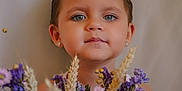 Chloé participe au concours pour gagner de l'argent avec cette photo : background, blue_eyes, bouquet, calm, child, closeup, cute, earrings, face, flowers, greenery, innocent, nature, pink_flowers, portrait, purple_flowers, soft_light, toddler, wildflowers, young_child