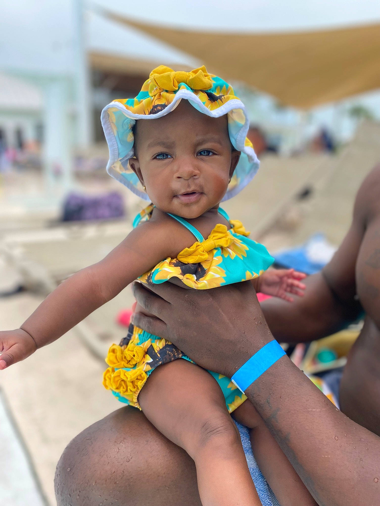 Kennedy joined the competition — help win amazing prizes! abdomen, body_of_water, child, event, facial_expression, fun, hairstyle, happy, hat, head, headwear, human_leg, leisure, person, recreation, sun_hat, thigh, toddler, trunk, undergarment