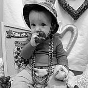 Cris joined the competition — help win amazing prizes! baby, beads, black_and_white, child, clothing, cozy, cute, decoration, face, hand, hat, heart, indoor, love, person, plaid, portrait, sitting, snack, toy
