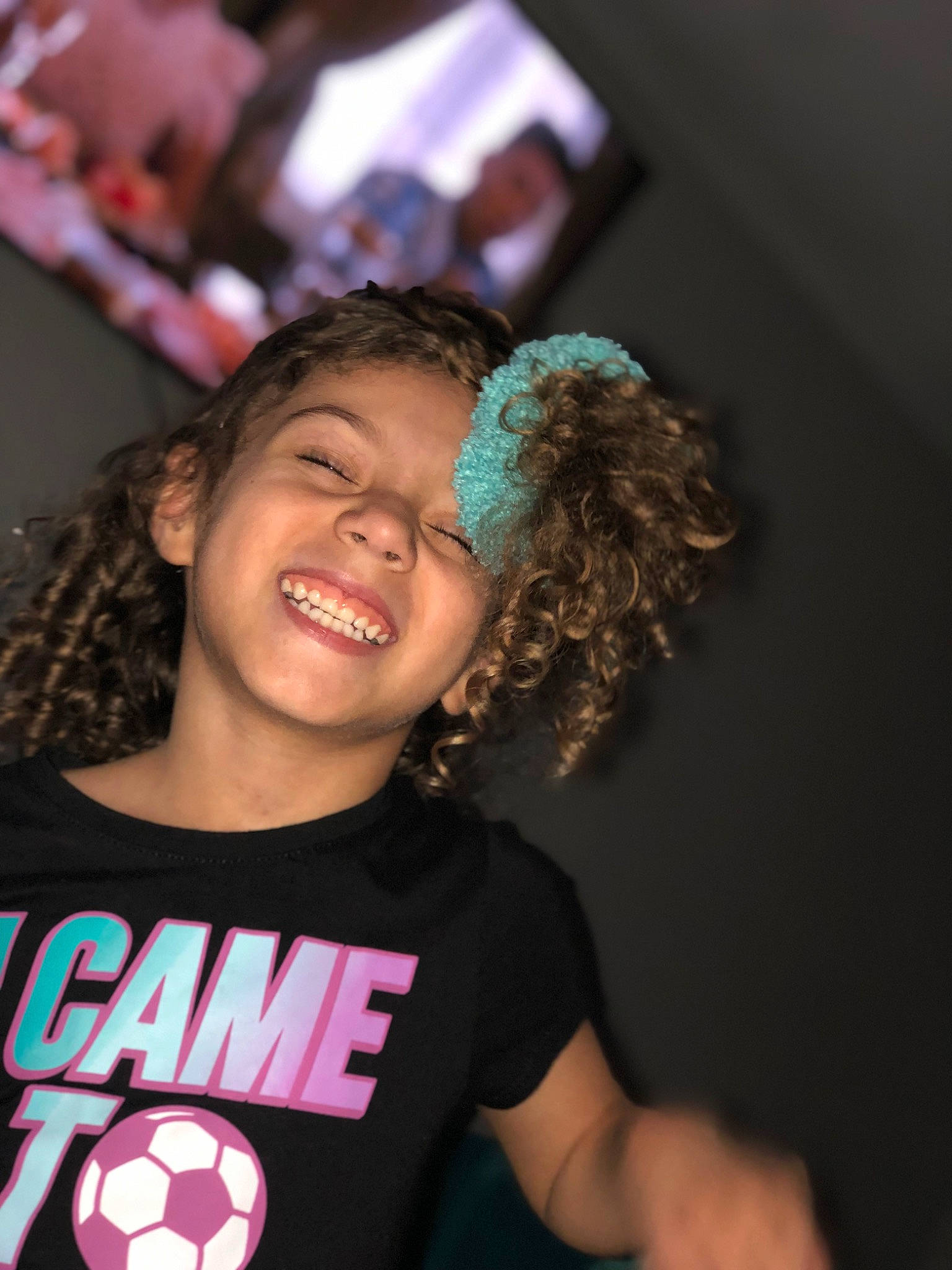 Attianna is registered to the contest to win money with this photo: arm, black, cheek, chin, cool, eyebrow, face, facial_expression, finger, flash_photography, gesture, hair, hairstyle, happy, joy, mouth, neck, person, ringlet, shoulder