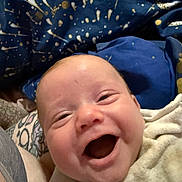 Henry joined the competition — help win amazing prizes! baby, smile, happy, infant, blanket, face, expression, cozy, closeup, child, joy, human, skin, head, indoors, person, fabric, pattern, warmth, comfort
