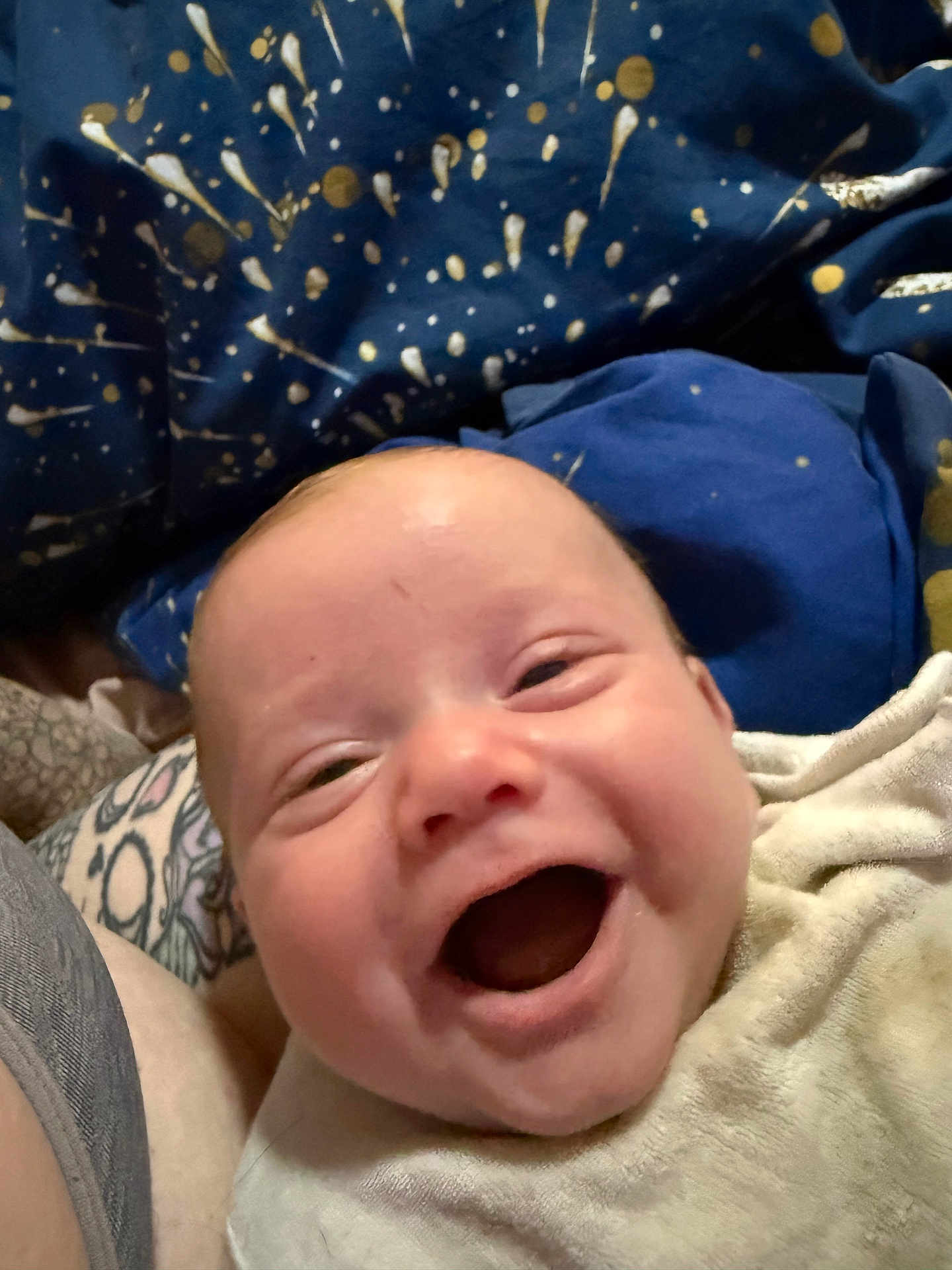 Henry joined the competition — help win amazing prizes! baby, smile, happy, infant, blanket, face, expression, cozy, closeup, child, joy, human, skin, head, indoors, person, fabric, pattern, warmth, comfort