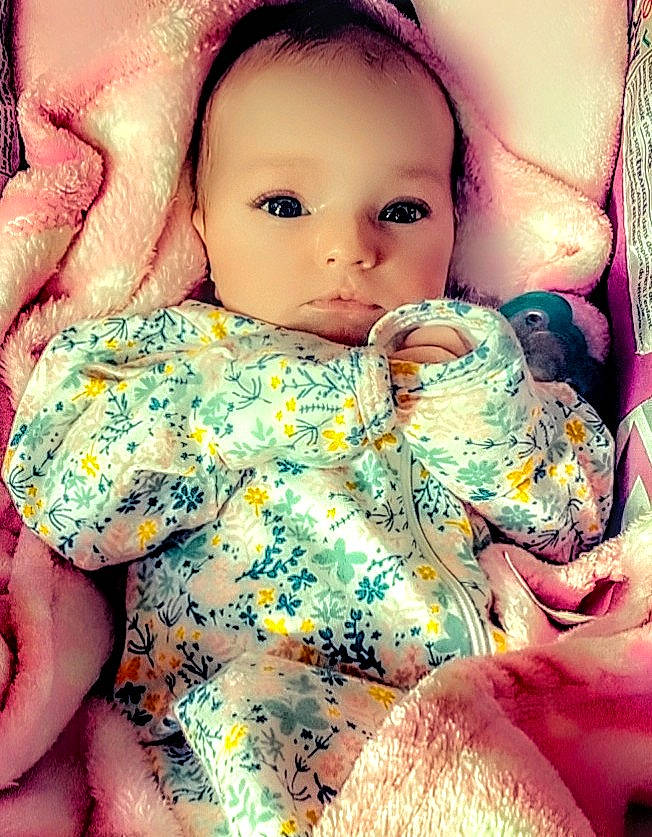 Brenna is registered to the contest to win money with this photo: baby_sleeping, baby_toddler_clothing, cheek, chin, doll, eye, eyelash, face, finger, happy, head, iris, lip, mouth, nose, people_in_nature, person, pink, skin, textile