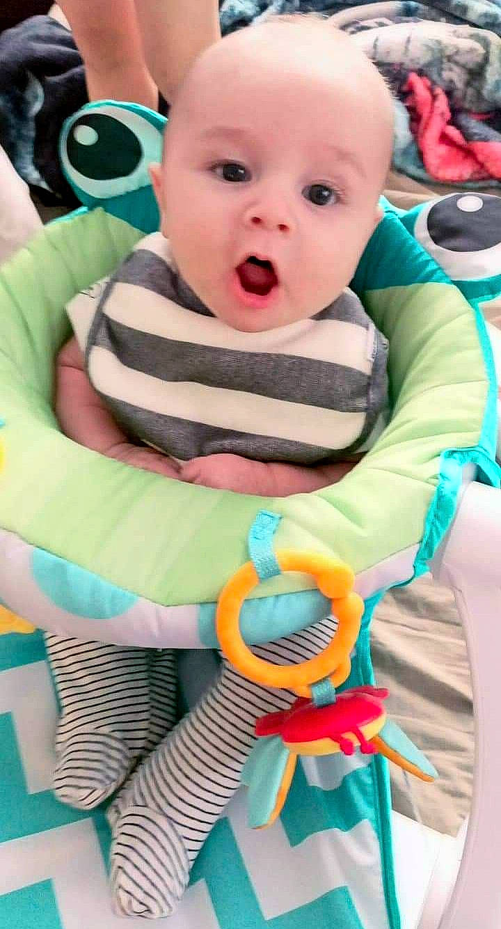 Aiden joined the competition — help win amazing prizes! baby, baby_products, baby_toddler_clothing, cheek, child, comfort, eye, eyelash, face, green, happy, iris, organ, person, sitting, skin, sleeve, surprise, t_shirt, toddler