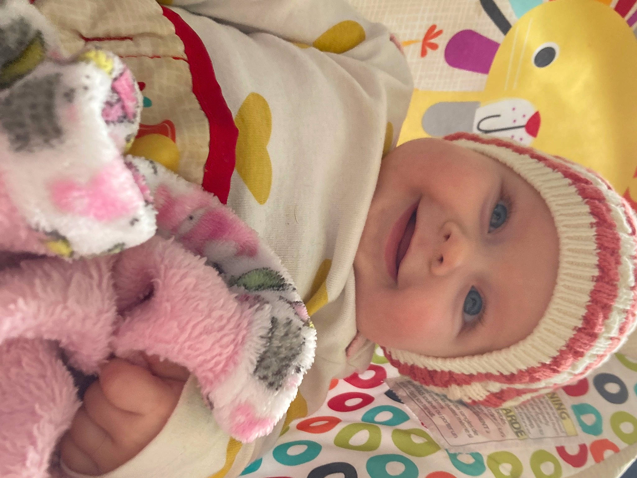 Avianna is registered to the contest to win money with this photo: baby, baby_products, baby_toddler_clothing, cap, cheek, child, fur, happy, headgear, headwear, joy, linens, nose, person, pink, plush, product, room, skin, stuffed_toy