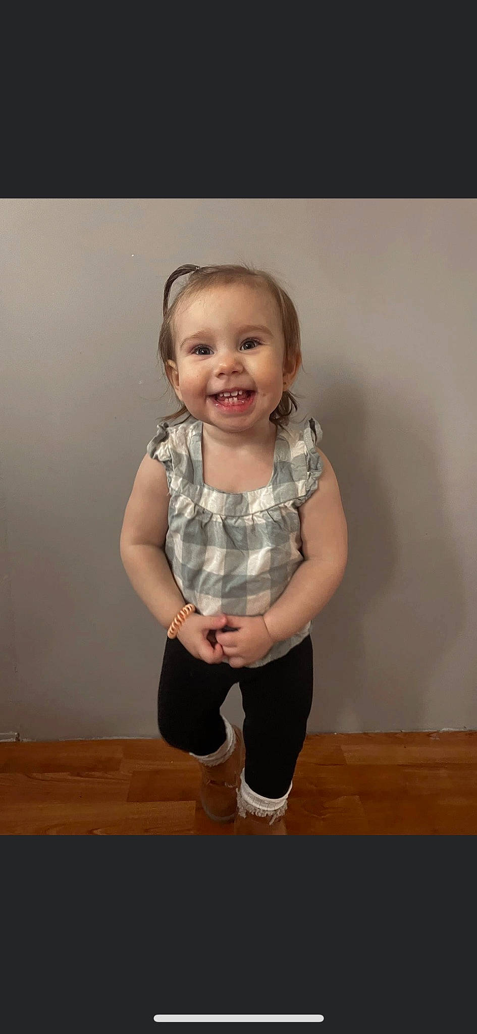 Austyn is registered to the contest to win money with this photo: baby_toddler_clothing, cheek, eye, face, flash_photography, floor, flooring, gesture, hair, happy, hardwood, joy, knee, leg, person, sleeve, smile, t_shirt, toddler, trunk