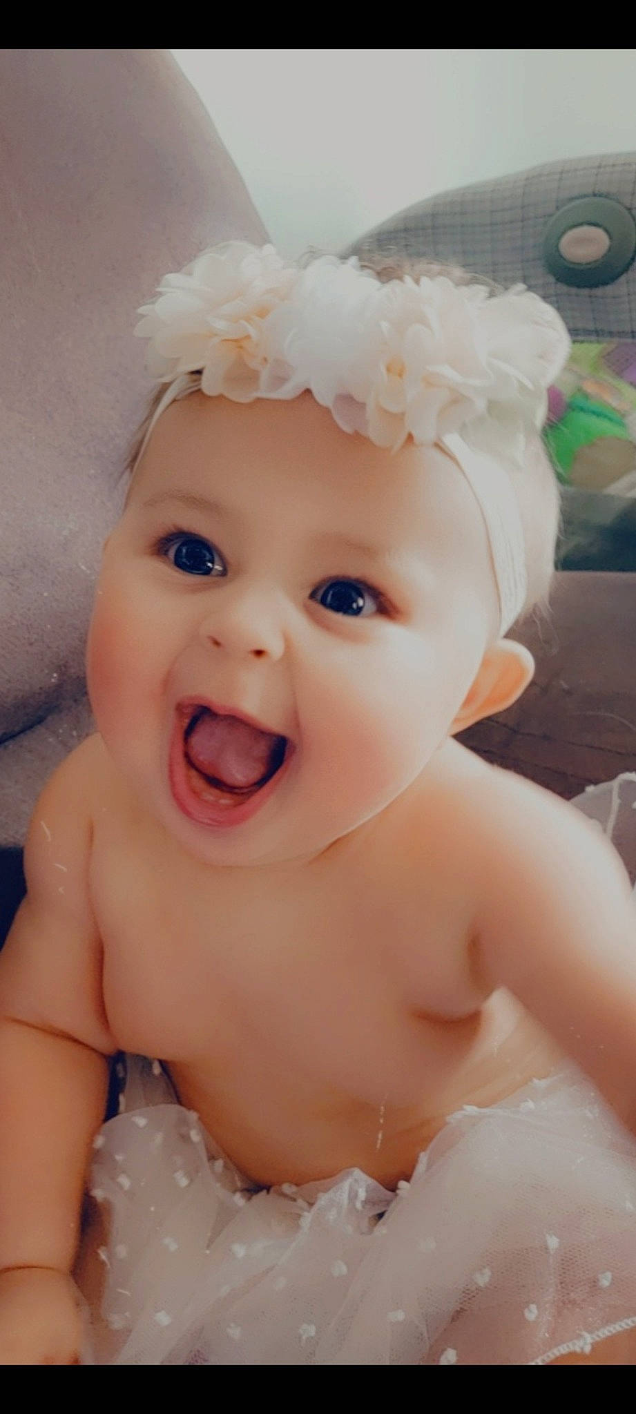 Freyja is registered to the contest to win money with this photo: baby, baby_toddler_clothing, cap, cheek, chin, ear, eye, eyebrow, eyelash, face, facial_expression, happy, head, headwear, iris, lip, mouth, nose, organ, person