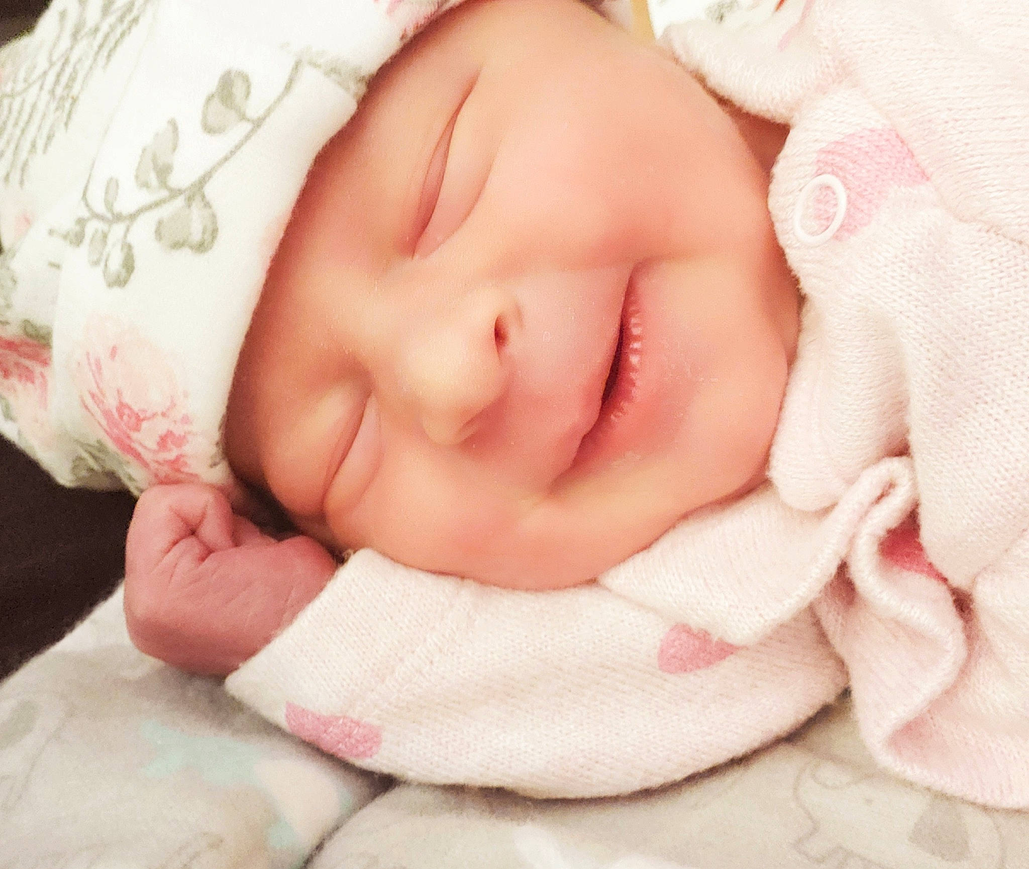 Freyja is registered to the contest to win money with this photo: arm, baby_toddler_clothing, cheek, chin, clothing, comfort, eyebrow, eyelash, face, finger, gesture, hand, happy, iris, lip, mouth, nose, person, pink, skin