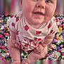 baby, child, clothing, colorful, cute, eyes, face, floral_background, flowers, hands, happy, indoors, infant, legs, portrait, sitting, skin, smiling, soft_lighting, strawberry_print