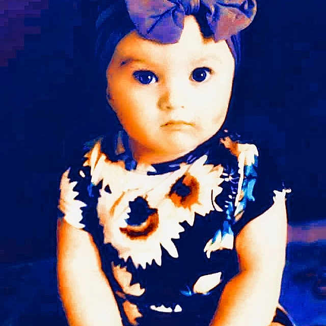 Callie is registered to the contest to win money with this photo: baby_toddler_clothing, blue, costume_hat, day_dress, doll, electric_blue, eyelash, fawn, flash_photography, fun, fur, happy, magenta, one_piece_garment, pattern, pink, purple, sleeve, toy, violet