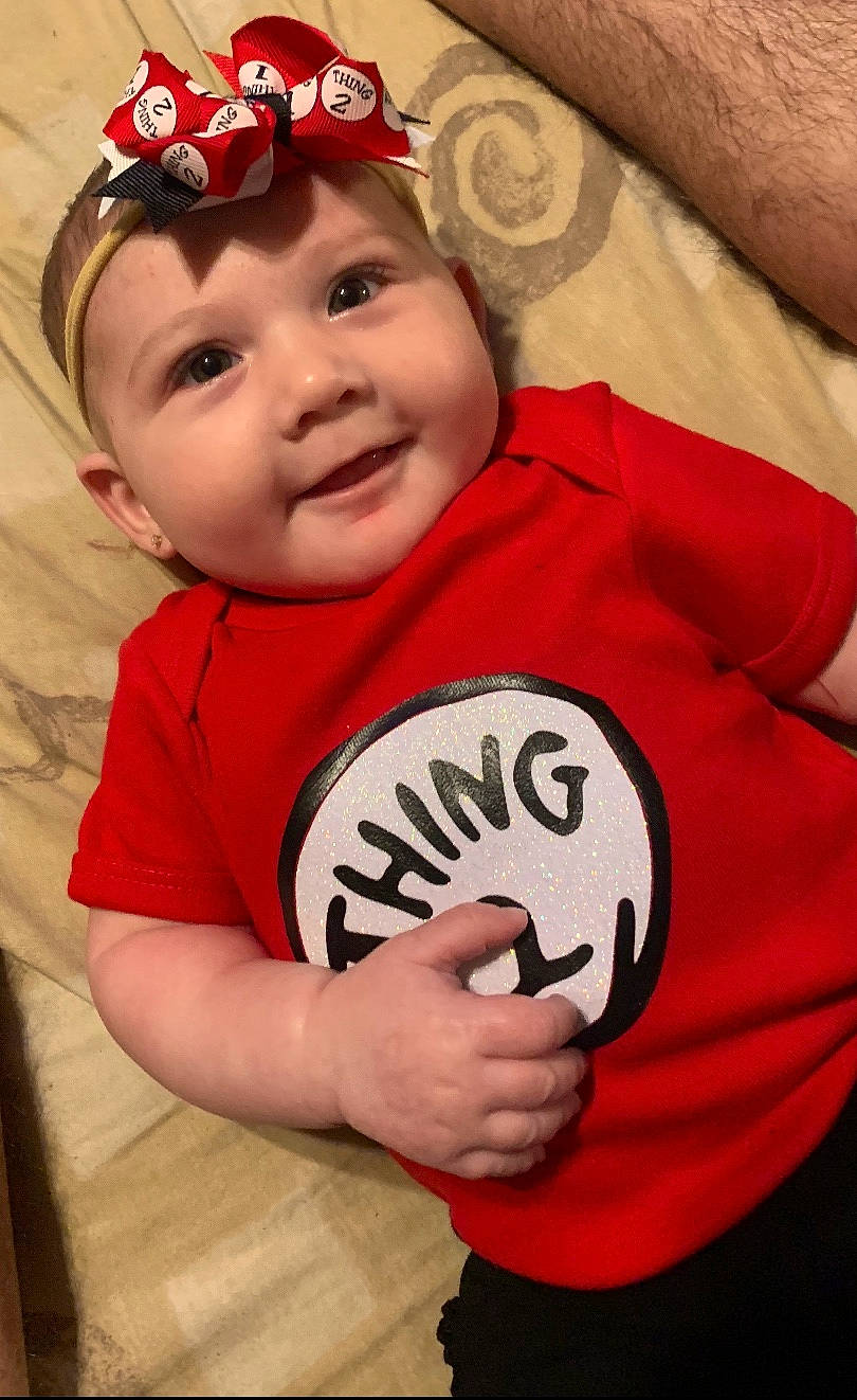 Tayler is registered to the contest to win money with this photo: baby, baby_toddler_clothing, child, hair_accessory, joy, person, pink, red, toddler