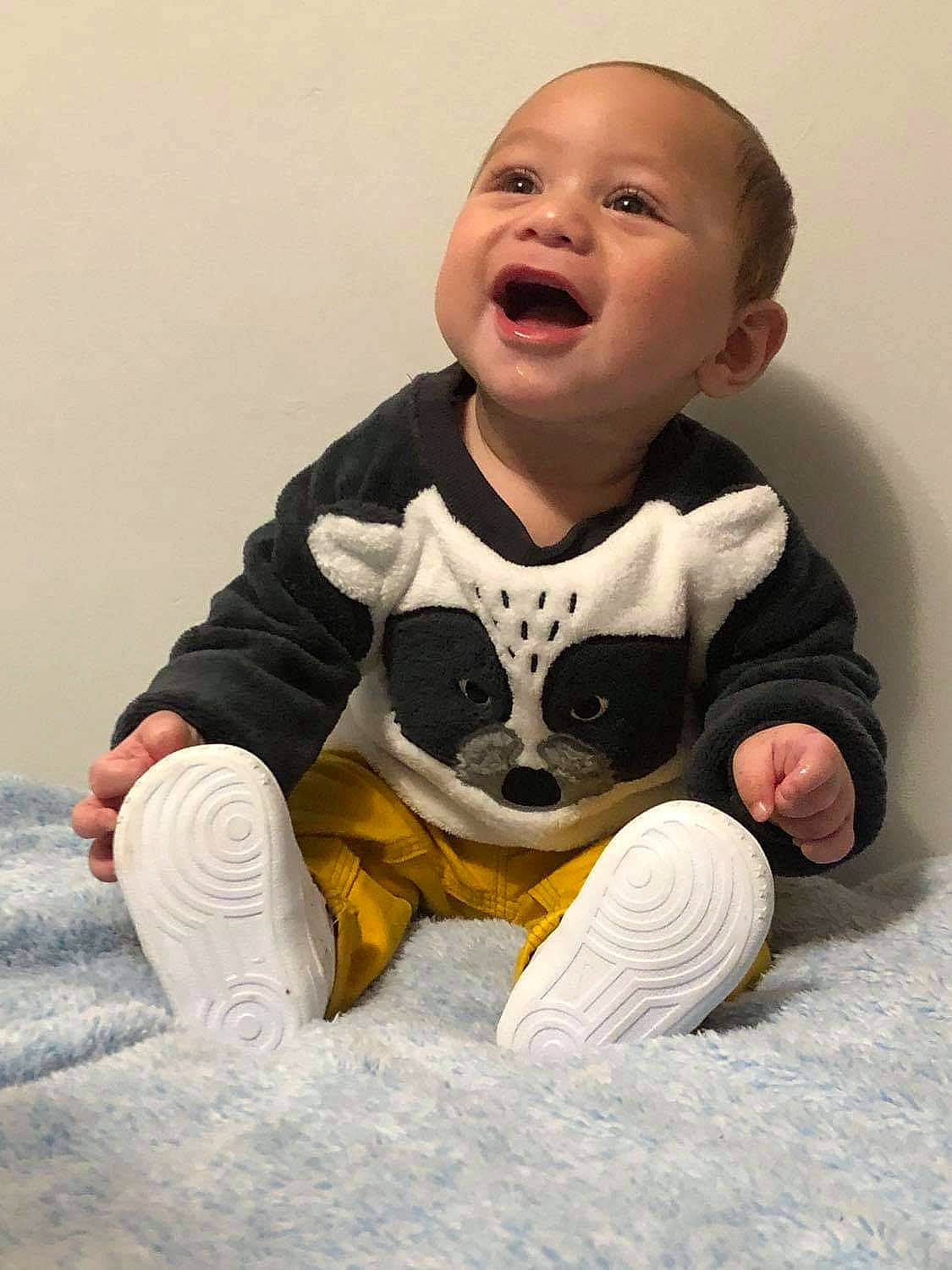 Remus joined the competition — help win amazing prizes! baby, baby_toddler_clothing, comfort, eye, face, finger, flooring, fun, happy, human_body, long_sleeved_t_shirt, mammal, person, personal_protective_equipment, sitting, sleeve, smile, sneakers, t_shirt, toddler