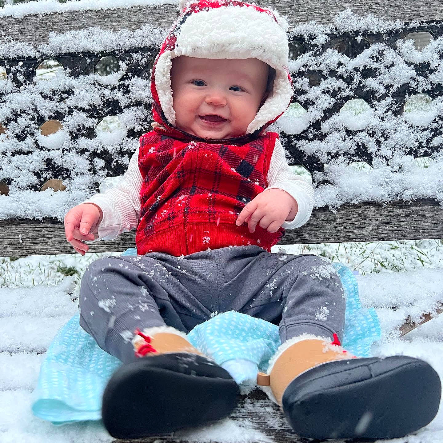 Ezra is registered to the contest to win money with this photo: baby, baby_toddler_clothing, cheek, child, clothing, electric_blue, face, freezing, fun, happy, headwear, leisure, outerwear, pattern, person, pink, sitting, sleeve, snow, toddler