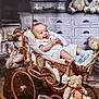 baby, blanket, child, cozy, cute, drawer, furniture, happy, indoor, infant, plush_toy, portrait, rustic, smiling, stroller, teddy_bear, toy, vintage, wicker, wood_floor