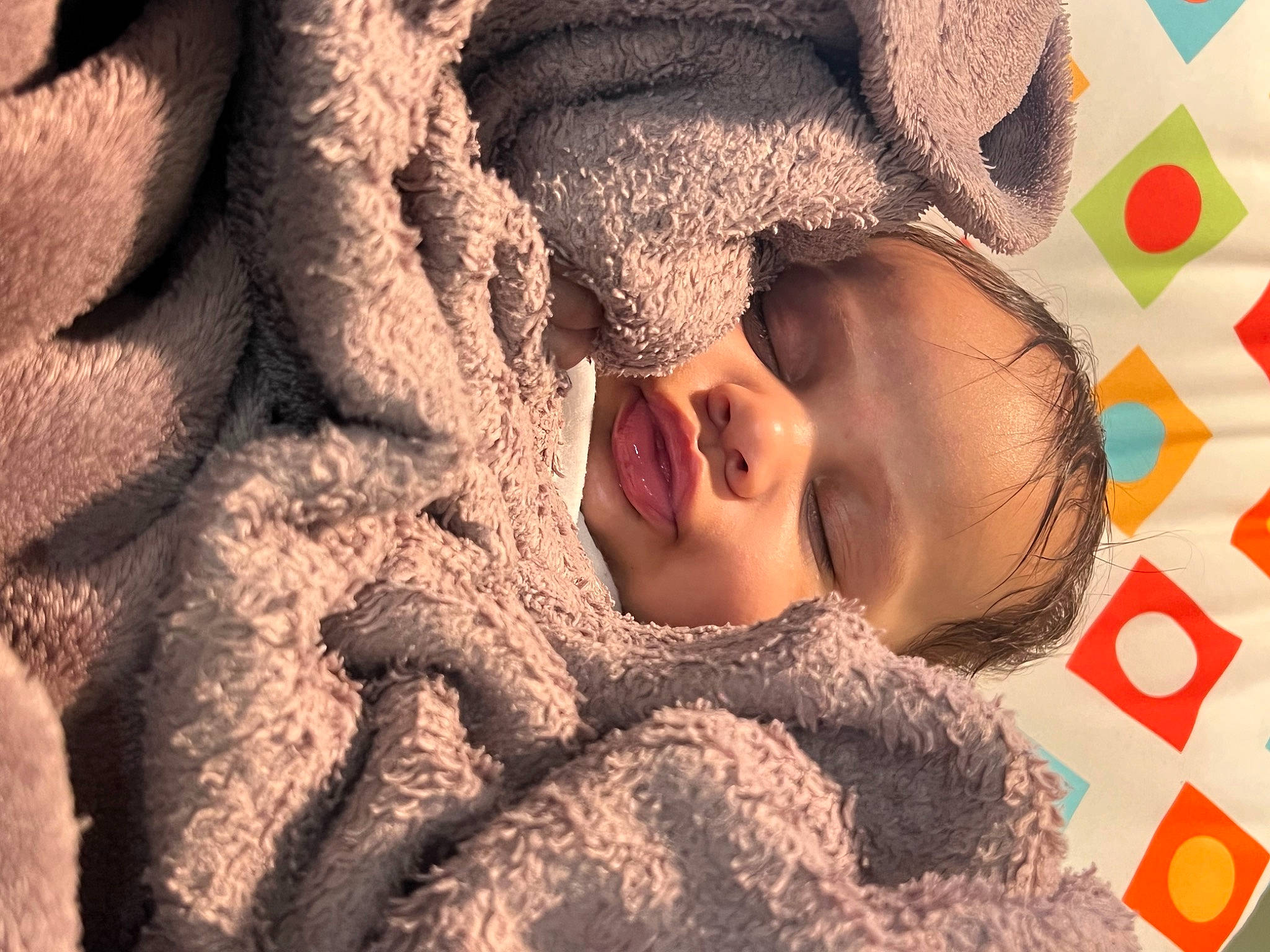 Lucia joined the competition — help win amazing prizes! baby, cheek, child, chin, close_up, comfort, eye, face, forehead, fur, happy, linens, lip, mammal, nose, pattern, person, skin, textile, toddler